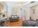 Living room with a view into the foyer, with chair and detailed ceiling and trim at 3058 Hyco Lake Ct, Fuquay Varina, NC 27526