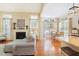 Open-concept living space connects the living room and breakfast nook, with hardwood floors at 3058 Hyco Lake Ct, Fuquay Varina, NC 27526