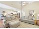 Open-concept living space featuring hardwood floors, a kitchen, and a sectional sofa at 3058 Hyco Lake Ct, Fuquay Varina, NC 27526