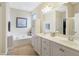 Large bathroom features double sinks, soaking tub and walk-in shower at 3058 Hyco Lake Ct, Fuquay Varina, NC 27526
