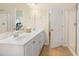 Main bathroom with a double vanity, framed mirror, and a walk-in shower at 3058 Hyco Lake Ct, Fuquay Varina, NC 27526