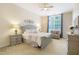 Charming main bedroom with decorative wall art, ceiling fan and outdoor access to backyard at 3058 Hyco Lake Ct, Fuquay Varina, NC 27526
