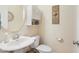 A neutral powder room with framed mirror and pedestal sink at 3058 Hyco Lake Ct, Fuquay Varina, NC 27526
