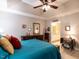 This primary bedroom features a tray ceiling with fan, and dual dressers with mirrors for a relaxing retreat at 3652 E Cotton Gin Dr, Clayton, NC 27527