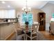 Open kitchen with granite countertops and a breakfast nook featuring a chandelier and table at 3652 E Cotton Gin Dr, Clayton, NC 27527