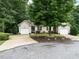 Inviting home featuring neutral siding, green shutters, attached garages, and a spacious front yard at 3652 E Cotton Gin Dr, Clayton, NC 27527
