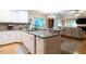 Bright, open kitchen featuring granite countertops and seamless flow into the living area at 3652 E Cotton Gin Dr, Clayton, NC 27527