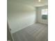 Comfortable carpeted bedroom featuring natural light from a single window at 369 Thompson Overlook Way, Smithfield, NC 27577