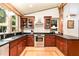Well-equipped kitchen with custom cabinets, stainless steel appliances, and stone countertops at 3822 Chicken Bridge Rd, Pittsboro, NC 27312