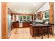 Bright kitchen with custom cabinets, modern appliances, and an eat-in island at 3822 Chicken Bridge Rd, Pittsboro, NC 27312