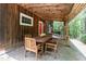Outdoor dining on a covered patio that is great for entertaining guests in this outdoor setting at 3822 Chicken Bridge Rd, Pittsboro, NC 27312