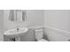 Powder room featuring clean, modern fixtures and bright lighting at 3921 Robins Nest Ln, Wake Forest, NC 27587