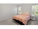 This bedroom has an inviting feel with carpet and two windows that bring in natural light at 3921 Robins Nest Ln, Wake Forest, NC 27587