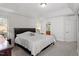 Spacious bedroom with trey ceilings, offering comfort and natural light from two windows at 3921 Robins Nest Ln, Wake Forest, NC 27587