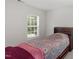 This bedroom offers a cozy space with a large window, carpet, and ample natural light at 3921 Robins Nest Ln, Wake Forest, NC 27587