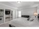 Spacious bedroom featuring built-in shelving and an ensuite bathroom, providing ample storage at 3921 Robins Nest Ln, Wake Forest, NC 27587