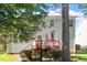 This exterior view features a wooden deck, lush trees, and a well-maintained lawn at 3921 Robins Nest Ln, Wake Forest, NC 27587