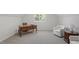 Bright office space with large desk, chair, and seating area, perfect for working from home at 3921 Robins Nest Ln, Wake Forest, NC 27587