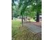 Spacious backyard including hammock, and outdoor wooded scenery at 394 Flanagan Rd, Henderson, NC 27537
