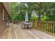 Great home deck with outdoor furniture and surrounding trees at 394 Flanagan Rd, Henderson, NC 27537