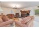 Inviting living room showcasing a brick fireplace and comfortable seating at 394 Flanagan Rd, Henderson, NC 27537