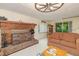 Cozy living room features a brick fireplace and comfortable seating at 394 Flanagan Rd, Henderson, NC 27537