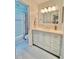 Renovated bathroom featuring custom vanity with lots of storage and a tiled shower/tub at 406 Fairoaks Cir, Chapel Hill, NC 27516