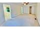 Bright and spacious carpeted bedroom with ample closet space and ceiling fan, perfect for relaxation at 406 Fairoaks Cir, Chapel Hill, NC 27516