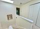 Hallway with staircase to second floor, featuring a skylight and neutral colors at 406 Fairoaks Cir, Chapel Hill, NC 27516