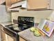 Close up view of the kitchen range, featuring modern appliances and light countertop space at 406 Fairoaks Cir, Chapel Hill, NC 27516