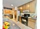 Cozy kitchen featuring stainless steel appliances, ample cabinet space, and a stylish, neutral countertop at 406 Fairoaks Cir, Chapel Hill, NC 27516
