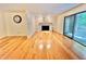 Cozy living room features a fireplace, creating a warm and inviting space in this charming condo at 406 Fairoaks Cir, Chapel Hill, NC 27516