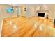 Spacious living room with a fireplace and an open layout, seamlessly connecting to other living spaces at 406 Fairoaks Cir, Chapel Hill, NC 27516