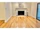 Bright living room with a fireplace, creating a comfortable atmosphere for relaxation and socializing at 406 Fairoaks Cir, Chapel Hill, NC 27516