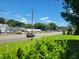 Street view featuring a Southern States store, framed by lush greenery under a clear blue sky at 411 W Raleigh St, Siler City, NC 27344