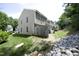 View of backyard with a stone embankment, showing property line and proximity to neighbors at 4224 Vienna Crest Drive Dr, Raleigh, NC 27613