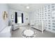 This Bedroom includes a letter rug, fun wallpaper, and a cozy chair at 4224 Vienna Crest Drive Dr, Raleigh, NC 27613