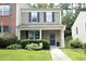 Charming two-story home with blue shutters, an American flag, and landscaped front yard at 4224 Vienna Crest Drive Dr, Raleigh, NC 27613
