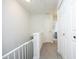 Bright hallway features neutral paint, carpet, and white doors at 4224 Vienna Crest Drive Dr, Raleigh, NC 27613