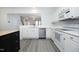 Bright kitchen featuring white cabinets, stainless steel appliances and a view to the doorway at 4224 Vienna Crest Drive Dr, Raleigh, NC 27613