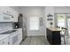 Bright kitchen features white cabinets, stainless steel appliances and a butcher block kitchen island at 4224 Vienna Crest Drive Dr, Raleigh, NC 27613