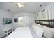 This main bedroom features a ceiling fan and a sliding barn door to the bathroom at 4224 Vienna Crest Drive Dr, Raleigh, NC 27613