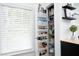 Walk-in pantry next to a sunny window, includes shelving and tons of storage for food at 4224 Vienna Crest Drive Dr, Raleigh, NC 27613