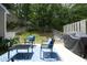 Cozy patio area with modern seating, a table and a grill, perfect for outdoor dining and relaxation at 4224 Vienna Crest Drive Dr, Raleigh, NC 27613