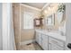 Bright bathroom featuring a shower, a white vanity with a sink, and neutral paint and tile at 4229 Cats Paw Ct, Wake Forest, NC 27587