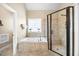 Relaxing bathroom with a soaking tub, tiled shower and decorative window at 4229 Cats Paw Ct, Wake Forest, NC 27587