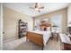 Cozy bedroom featuring a ceiling fan and a wooden bed frame and matching decor at 4229 Cats Paw Ct, Wake Forest, NC 27587