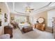 Bright bedroom featuring neutral walls, a ceiling fan, and natural light at 4229 Cats Paw Ct, Wake Forest, NC 27587