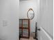 Walk-in closet featuring a cabinet, an oval mirror, and neutral walls at 4229 Cats Paw Ct, Wake Forest, NC 27587