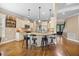 Spacious kitchen featuring granite countertops, stainless steel appliances, and hardwood floors at 4229 Cats Paw Ct, Wake Forest, NC 27587